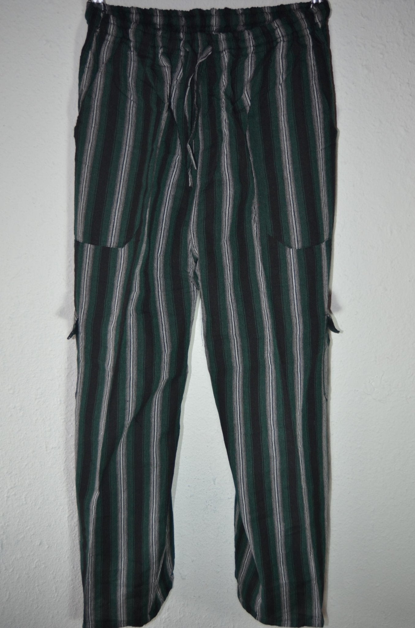 Handmade Peruvian hippie pants in dark green alpaca with vertical stripes and loose fit.
