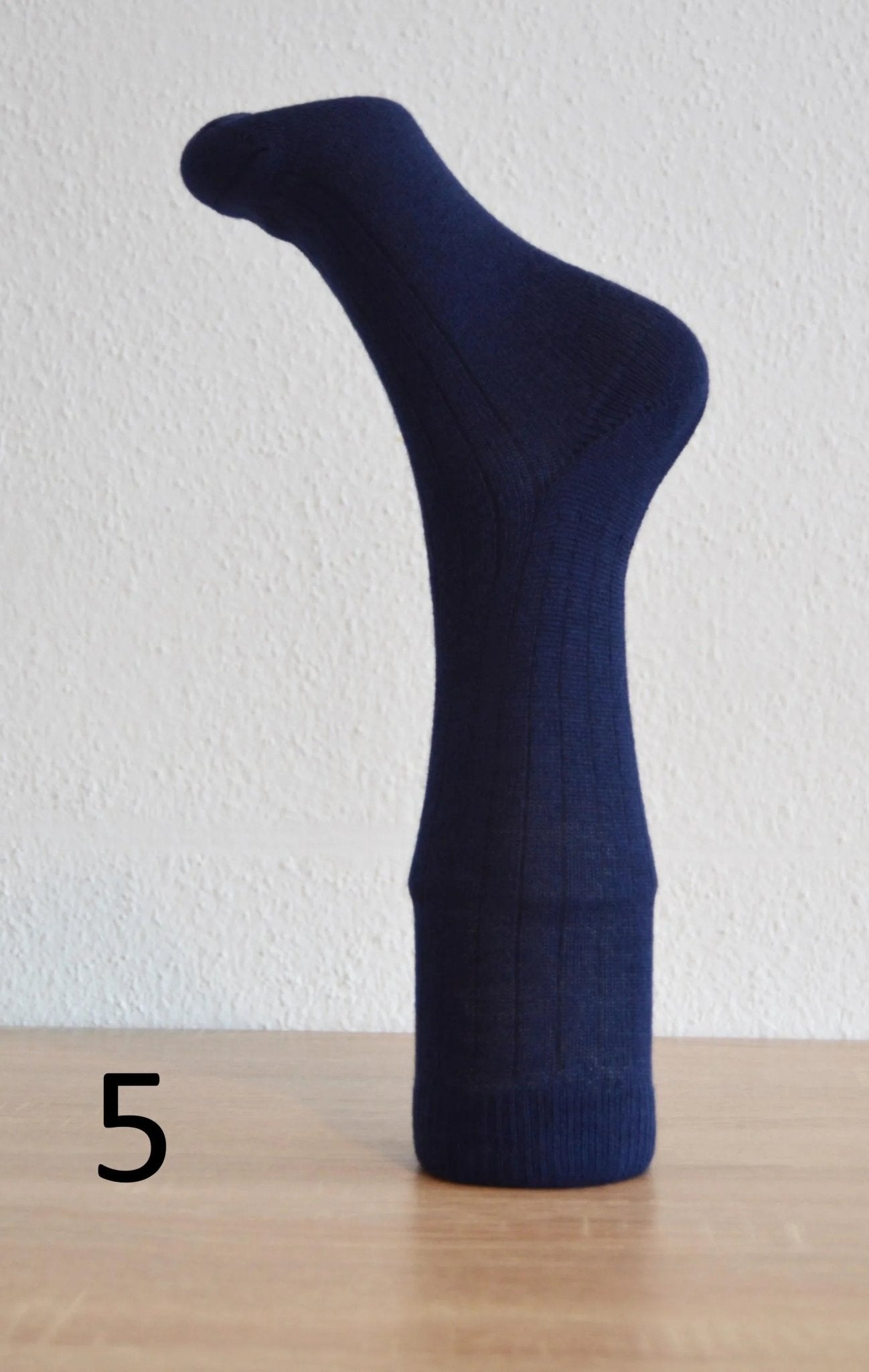 Handmade navy blue alpaca and cotton sock with ribbed cuff, cozy and warm design.