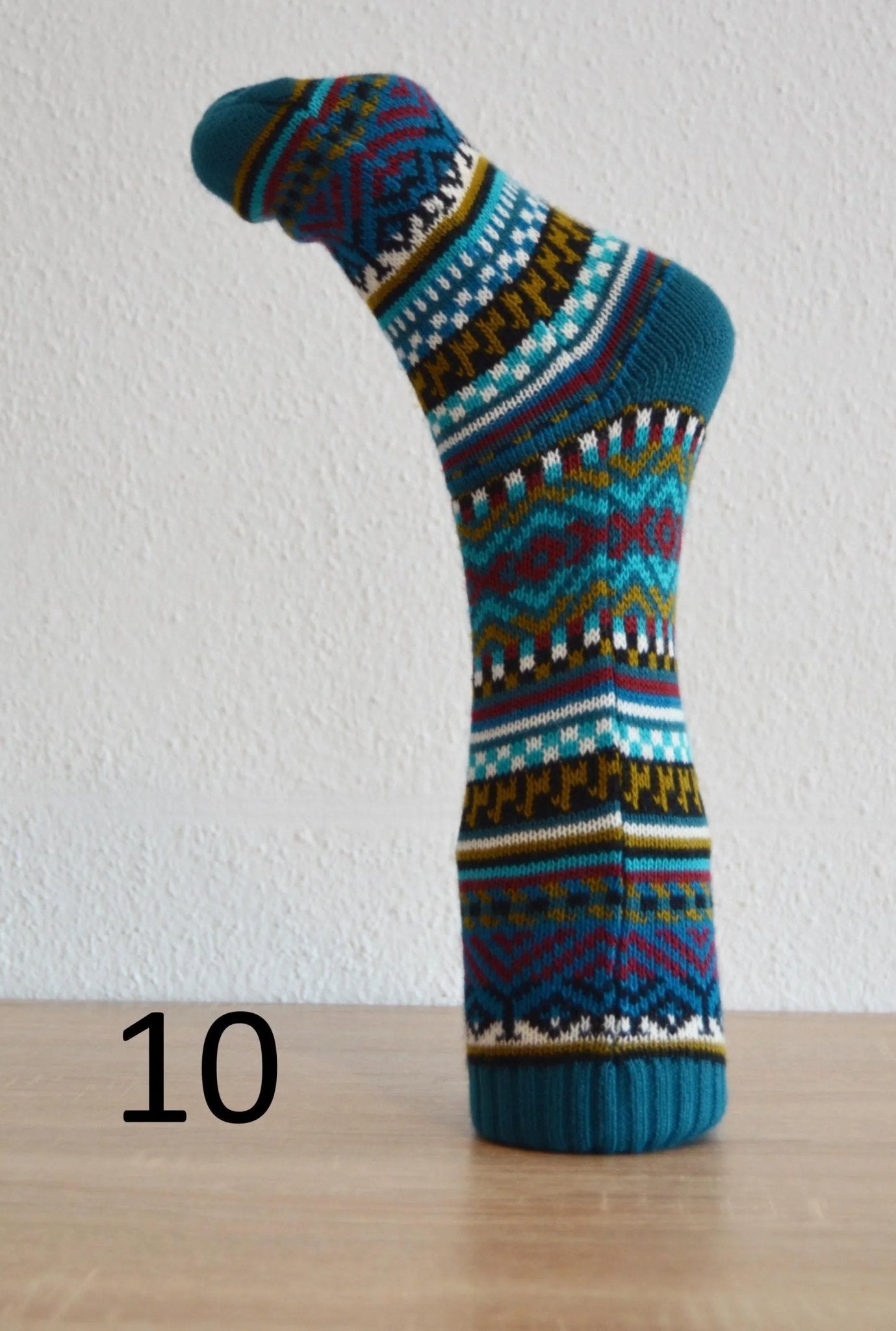 Handmade alpaca socks with multicolor geometric patterns in blue, brown, and white tones, size 10.