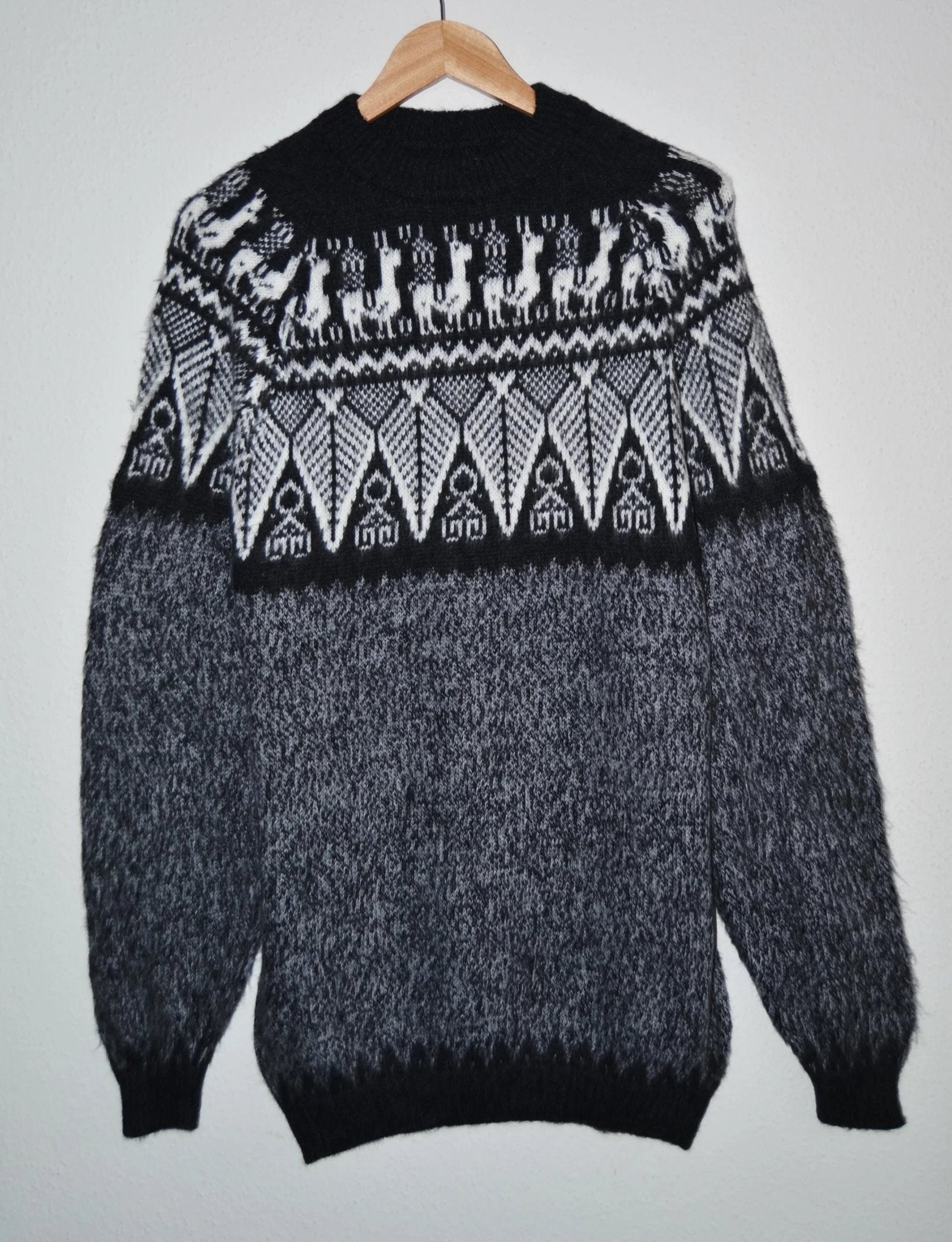 Handmade alpaca sweater in black and gray with geometric and llama patterns, crew neck.