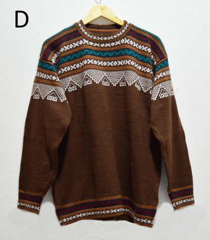 Handmade brown alpaca wool sweater with multicolor geometric patterns on yoke and cuffs.