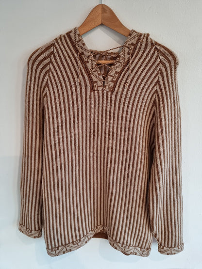 Handmade brown and beige striped alpaca wool sweater with lace-up collar and long sleeves.